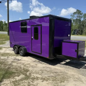 Purple custom cargo trailer with aluminum trim and bold logo, parked on gravel under blue sky.