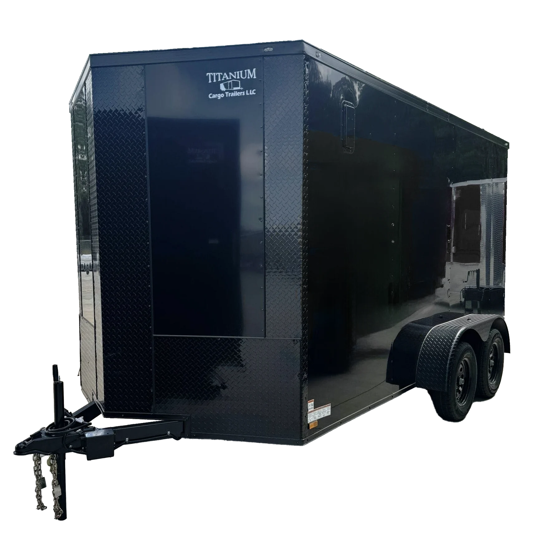 Custom black standard enclosed cargo trailer with aluminum trim, parked on paved concrete site.